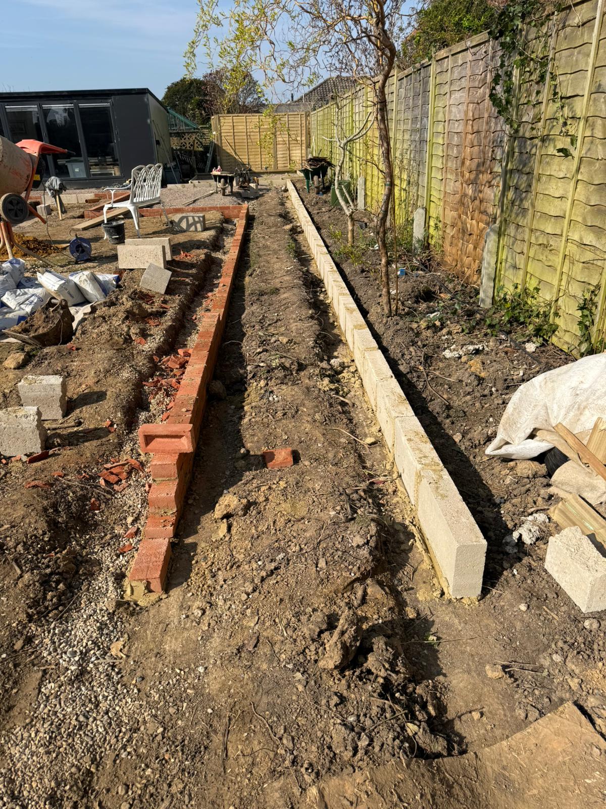 Brickwork edging and retaining walls during garden makeover West Sussex